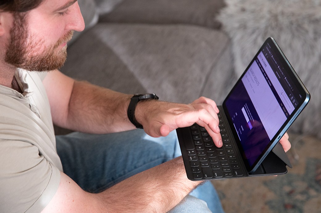 Person typing on smart keyboard