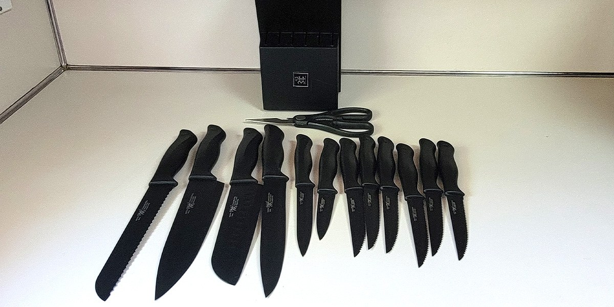 Hunter.Dual Knife set with black handles displayed on counter