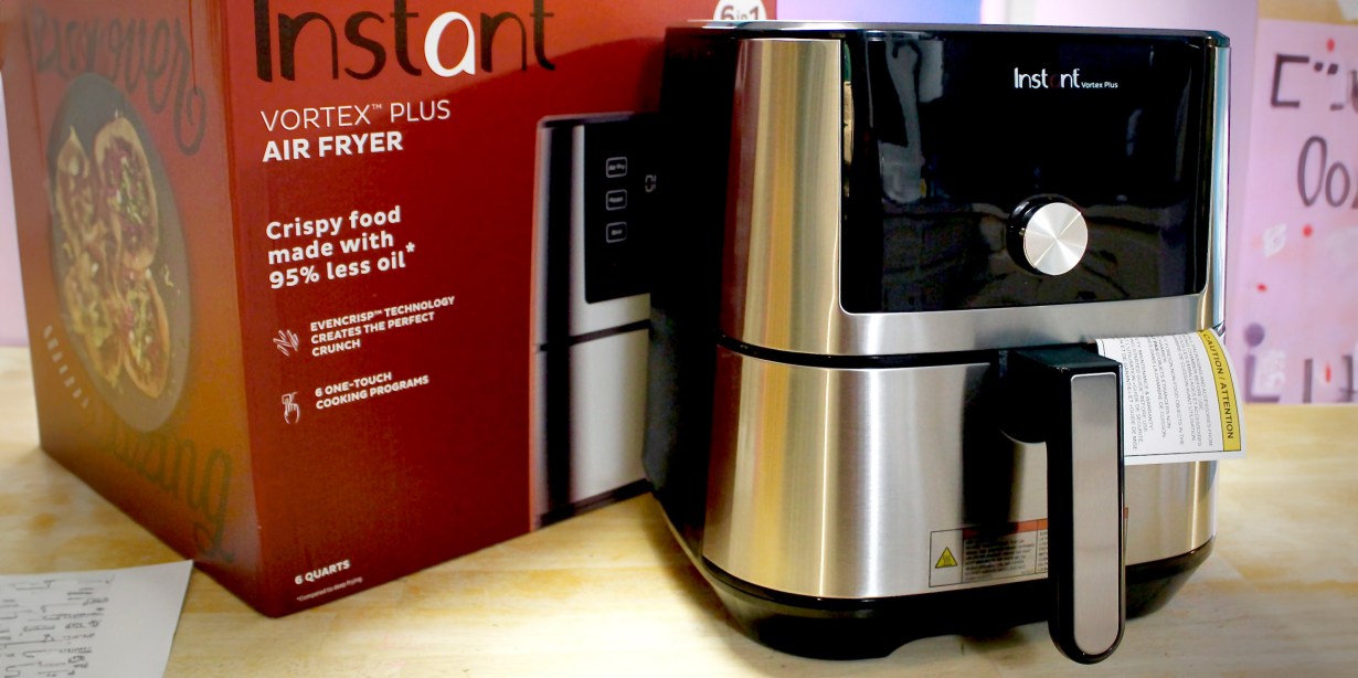 Instant Vortex Plus 6-Quart Air Fryer on counter next to branded product packaging