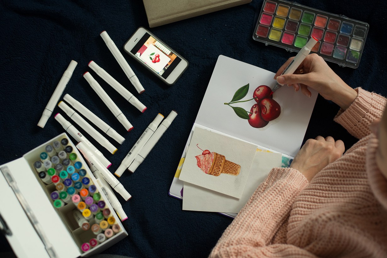 a person using paint pens