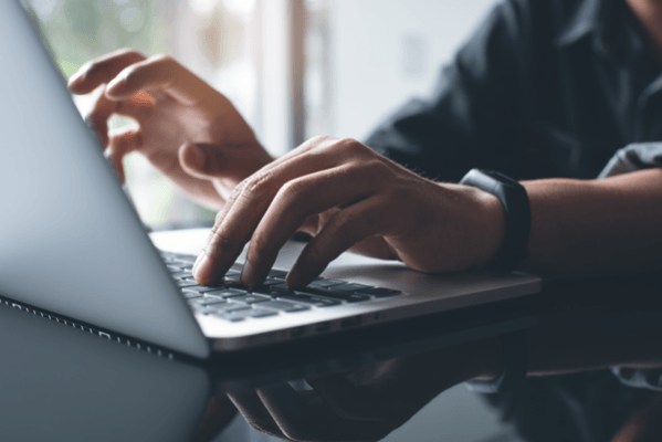 Person typing on a laptop