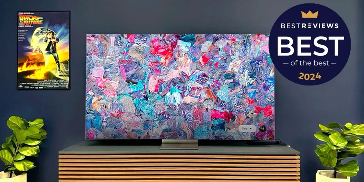 Samsung QN900D 8K QLED with colorful image on screen against dark gray wall