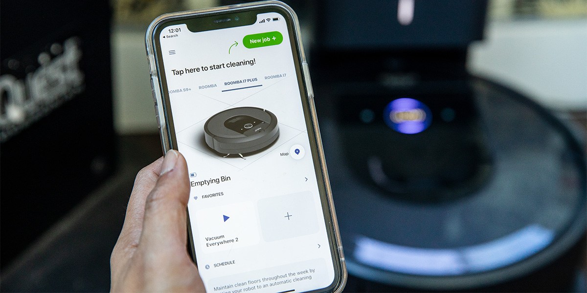Person uses iRobot app to manage Roomba