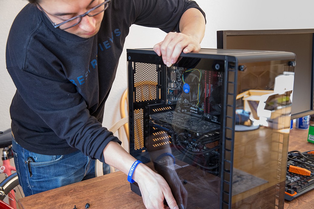 Person building gaming computer