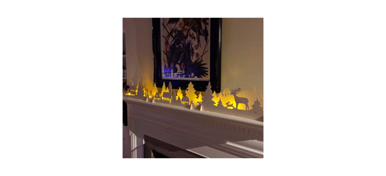 wooden Christmas mantel decorations of a winter forest