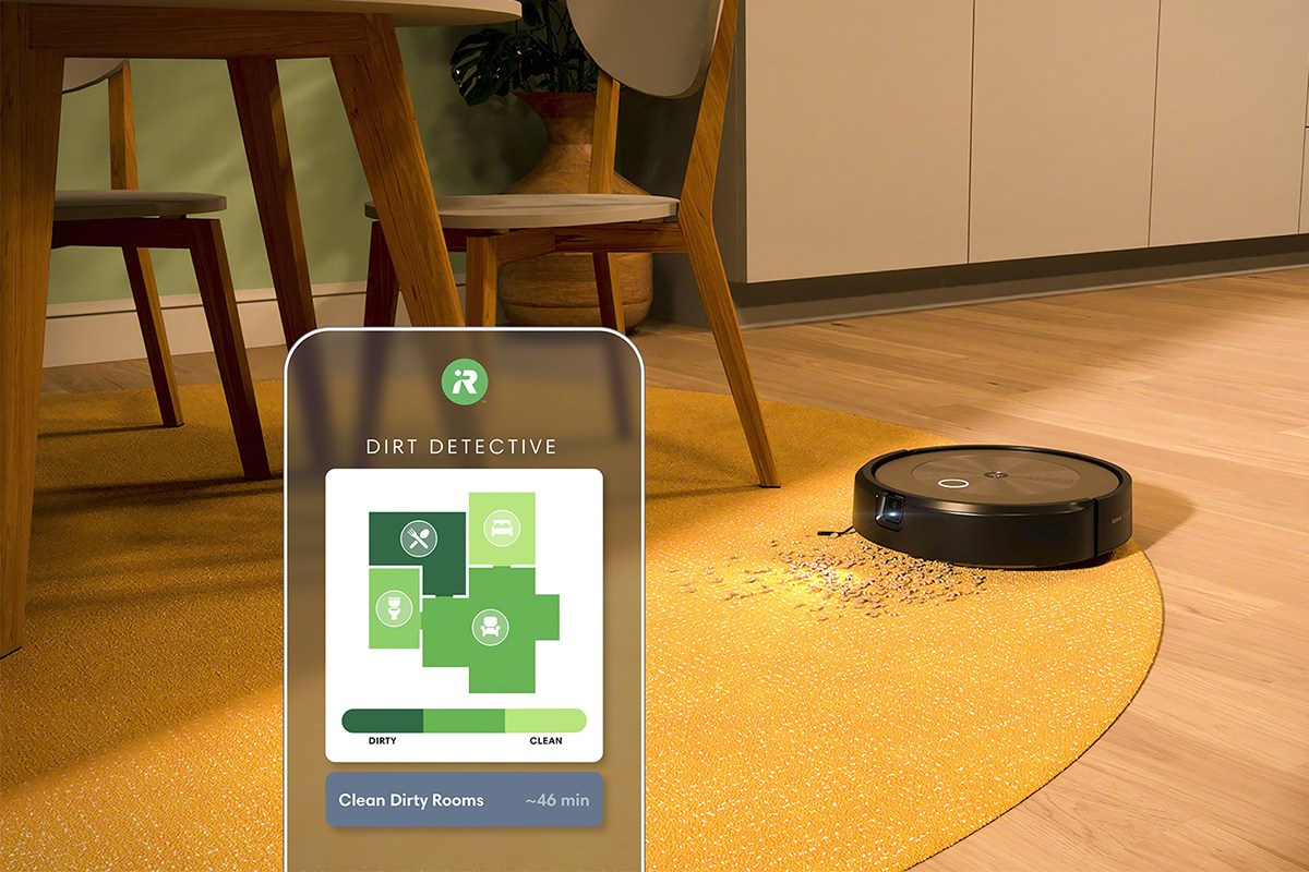 Roomba j9+ on yellow carpet with app image in front