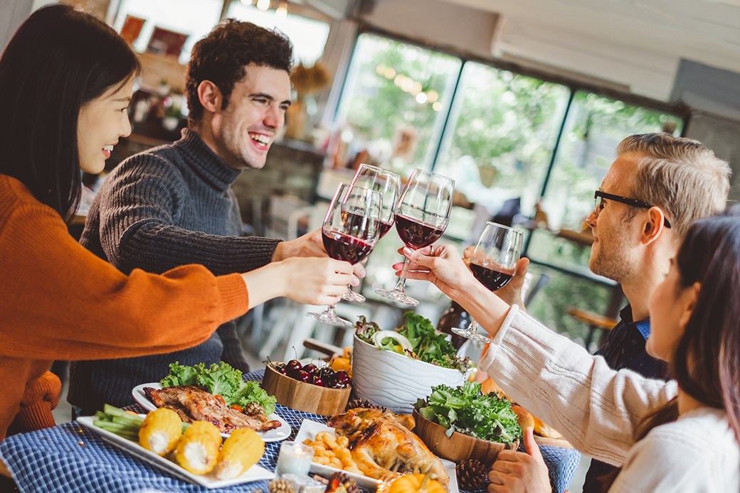 Friends toasting at Thanksgiving dinner