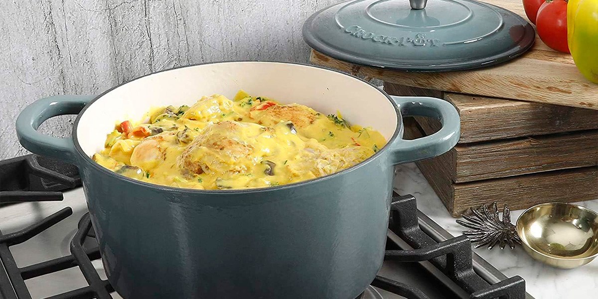 Crock-Pot Artisan 5-Quart Enameled Cast Iron Round Dutch Oven cooking food on stovetop