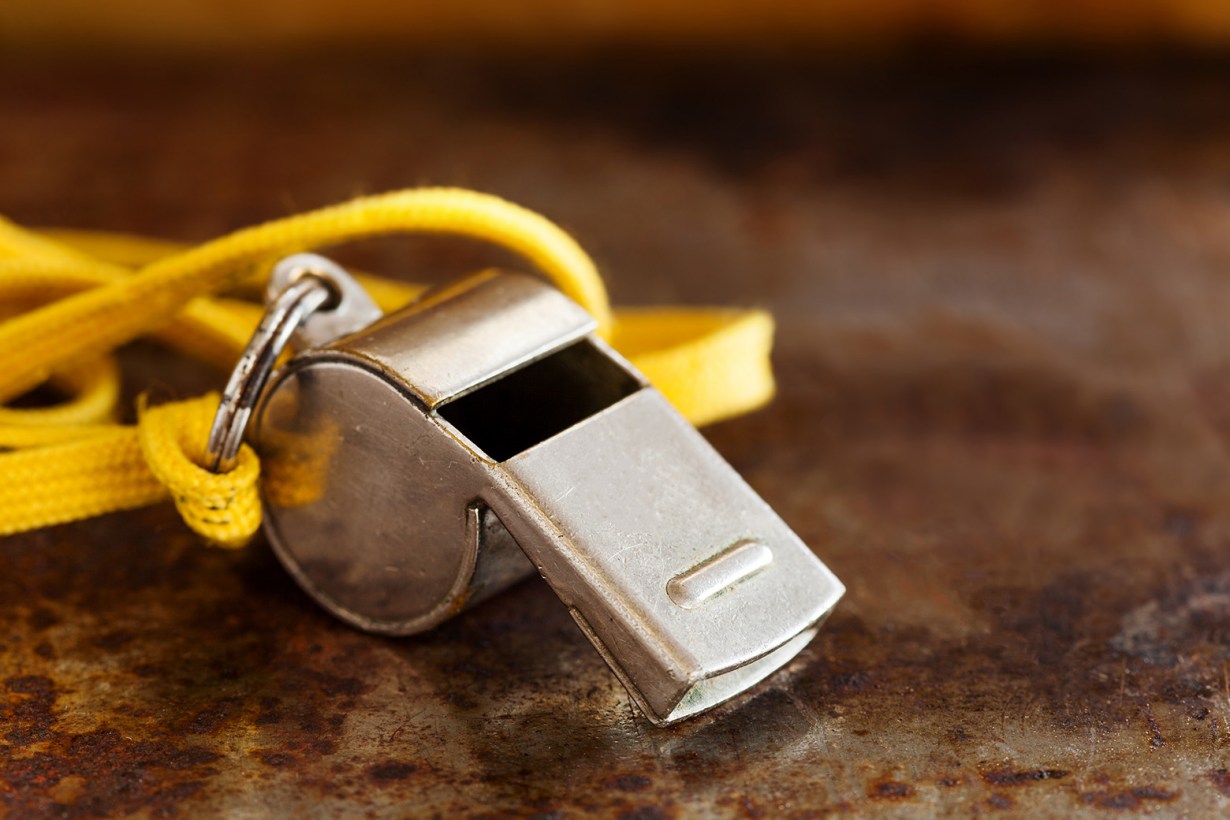 whistle with yellow lanyard